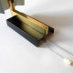 Matte black and brass clamshell wall light