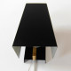 Matte black and brass clamshell wall light